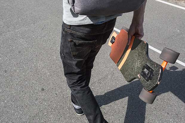 how to carry a longboard